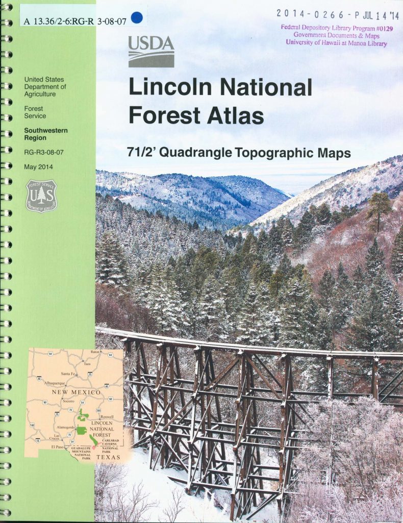 Cover of Lincoln National Forest atlas showing a train restle and snow-covered mountains.